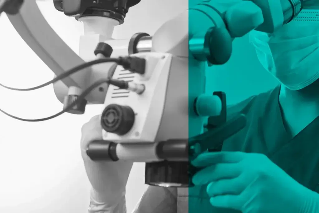 Zahnarzt schaut durch Mikroskop während der Wurzelbehandlung in Rüdesheim